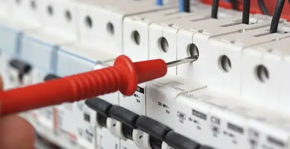 Electrical contractor testing circuit breakers during electrical repair in Elgin, SC