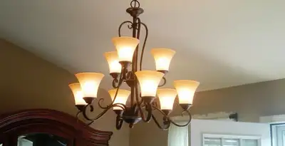 Classic ceiling chandelier installation with warm lighting in Columbia, SC