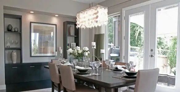 Elegant dining room chandelier installation above table in Columbia, SC