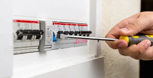 electrical panel upgrade service showing technician adjusting circuit breakers during system upgrade in Columbia, SC