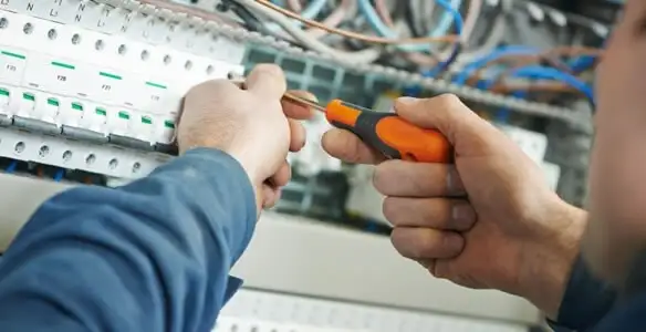 electrical service showing licensed electrician performing electrical panel maintenance and adjustments in Columbia, SC
