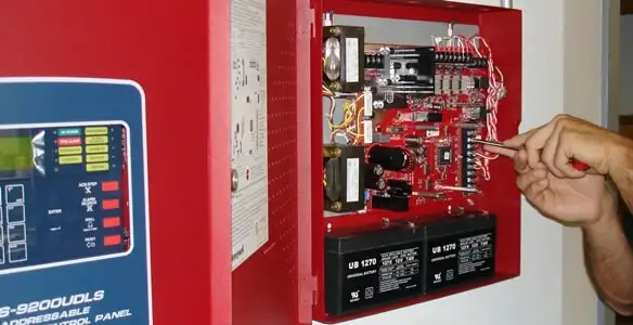 fire alarm installation service showing technician configuring fire alarm control panel in Columbia, SC