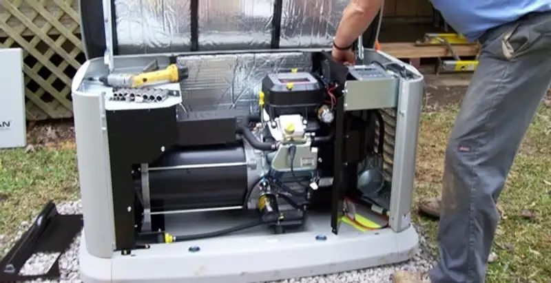 generator installation service showing technician connecting and configuring generator components in Columbia, SC