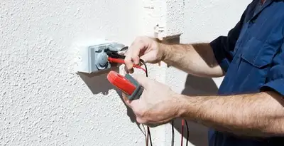Electrician performing home electrical outlet and wiring inspection in Columbia, SC