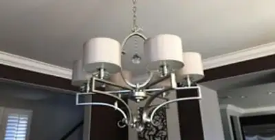Modern chandelier installation with multiple light fixtures in Columbia, SC