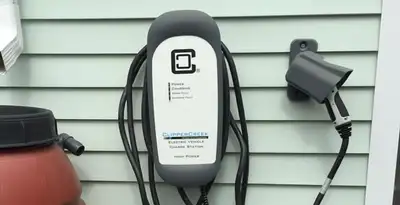 Outdoor electric vehicle charger installation on residential wall in Columbia, SC