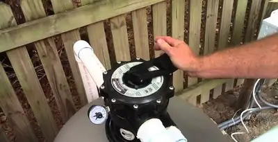 pool pumps service showing professional adjustment of pool pump control system in Columbia, SC