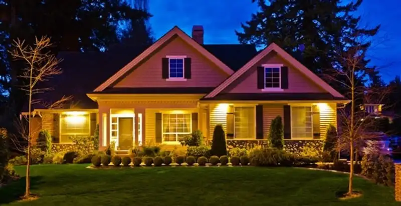 security light installation services illuminating a residential exterior at night in Columbia, SC