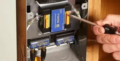 Whole home surge protection device being installed by a licensed electrician to protect electrical systems in Columbia, SC